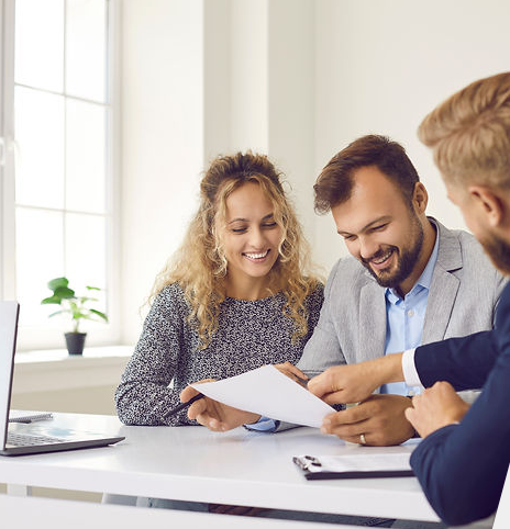 Agents reviewing a policy with a client at the Knoxville office